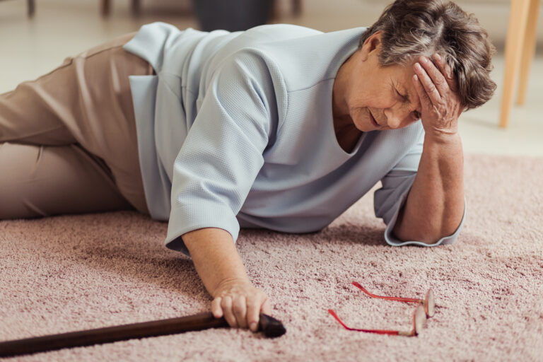 elderly woman who has fallen on the floor